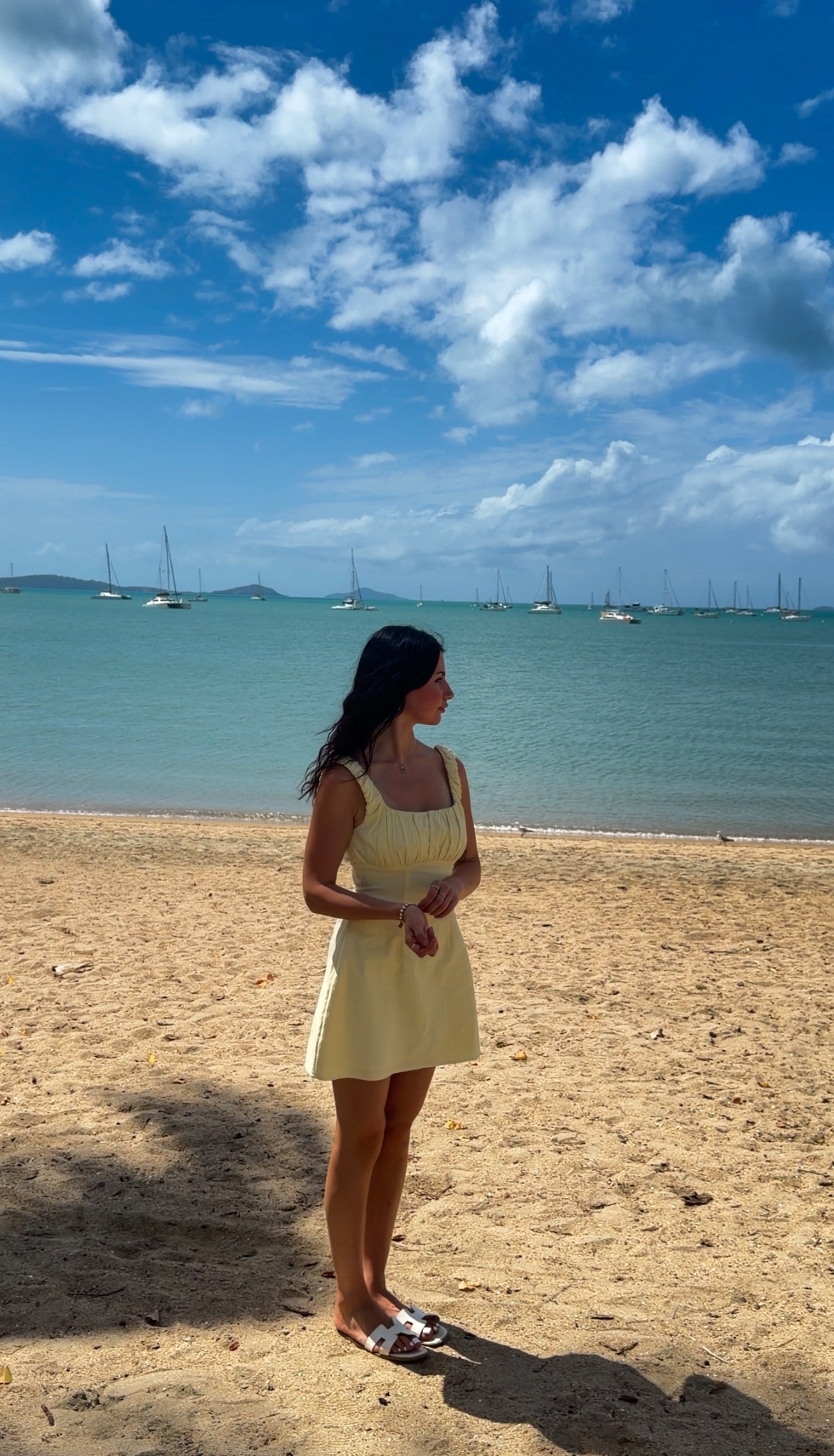Brooke on the beach in a yellow dress