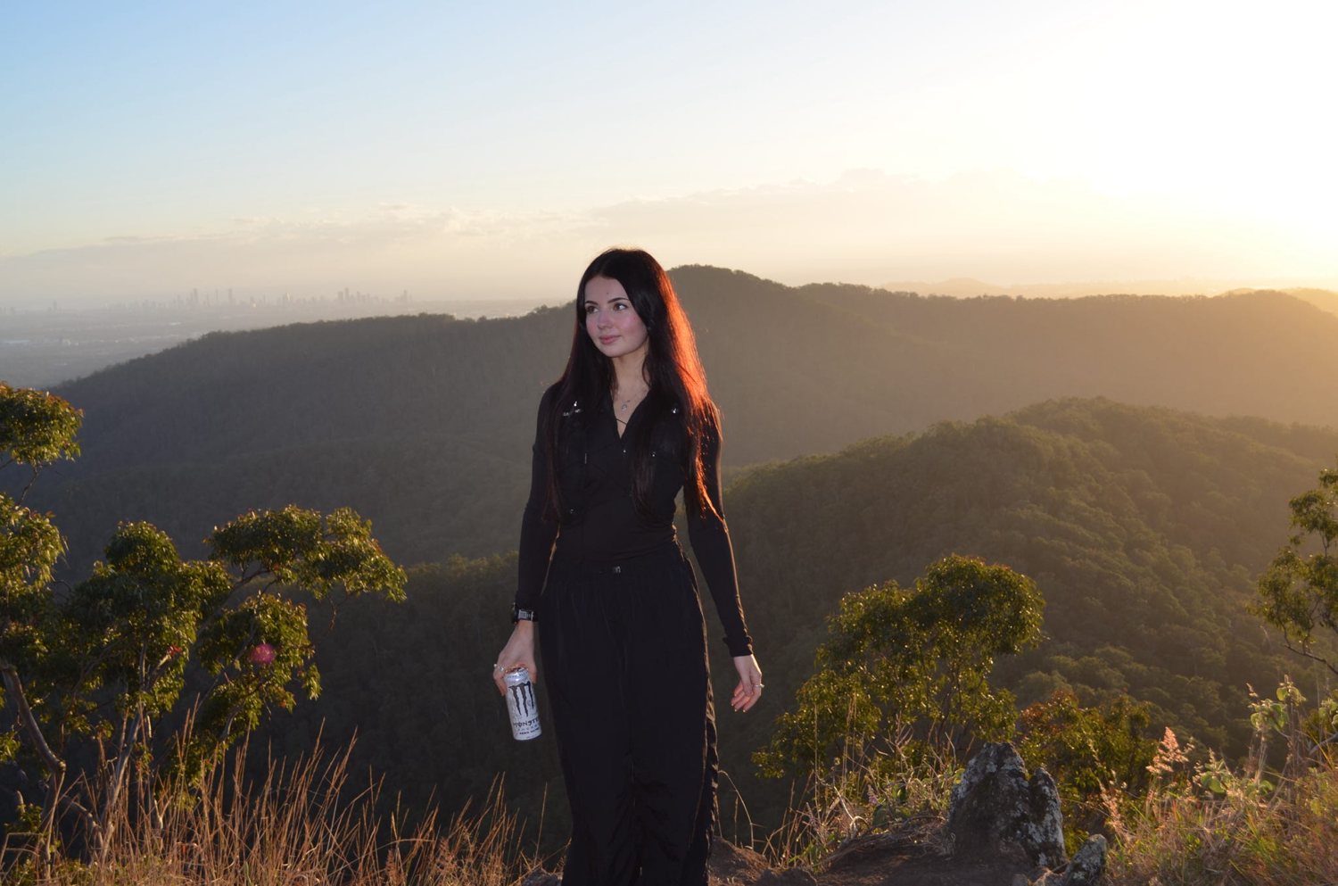 Brooke standing at golden hour in the mountains